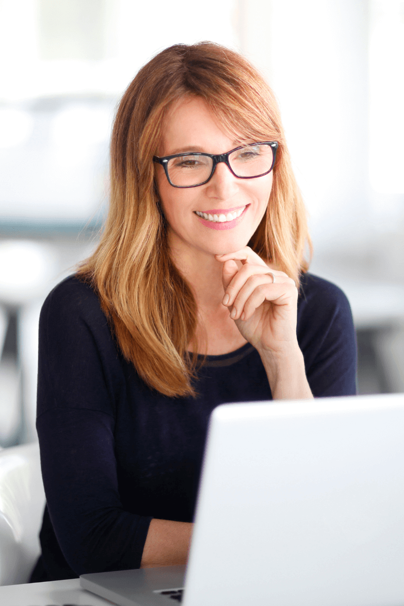 Smiling Woman at Laptop